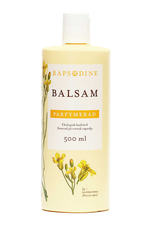 500 ml Balsam i ljusgul förpackning. Cylinderformad med vitt lock. Parfymerad. Rapsblommor i gul färg målade. Rapsodine i gul text överst på förpackning.
