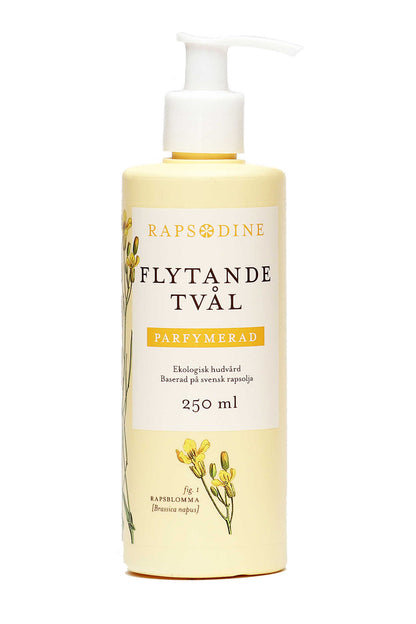 250 ml Flytande tvål utan pump i ljusgul förpackning. Cylinderformad med vitt lock. Parfymerad. Rapsblommor i gul färg målade. Rapsodine i gul text överst på förpackning.