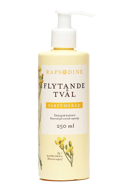 250 ml Flytande tvål utan pump i ljusgul förpackning. Cylinderformad med vitt lock. Parfymerad. Rapsblommor i gul färg målade. Rapsodine i gul text överst på förpackning.
